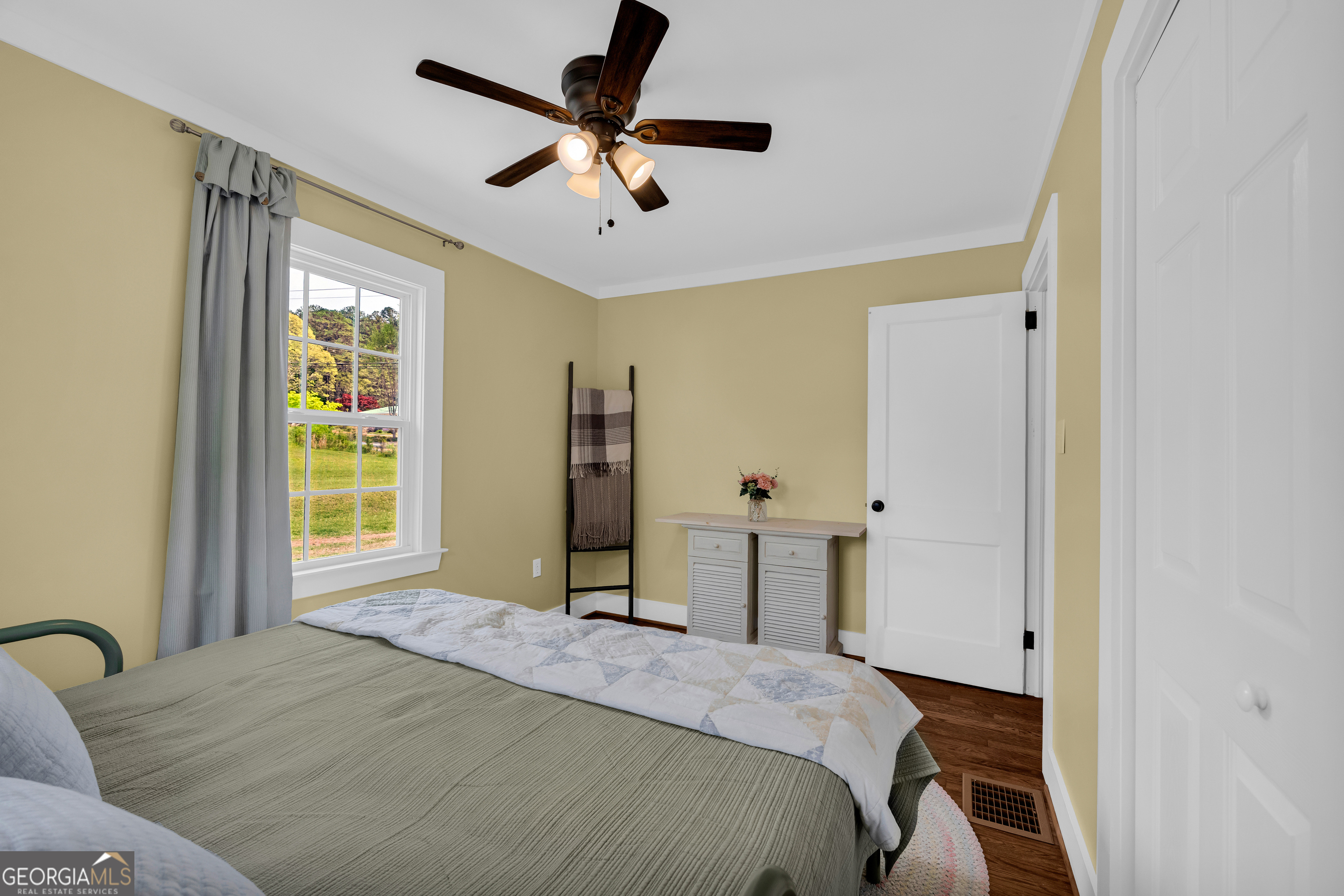 261 Oak Valley Road Toccoa, GA 30577 - Photo 30 of 52 a bedroom with a bed dresser and a window