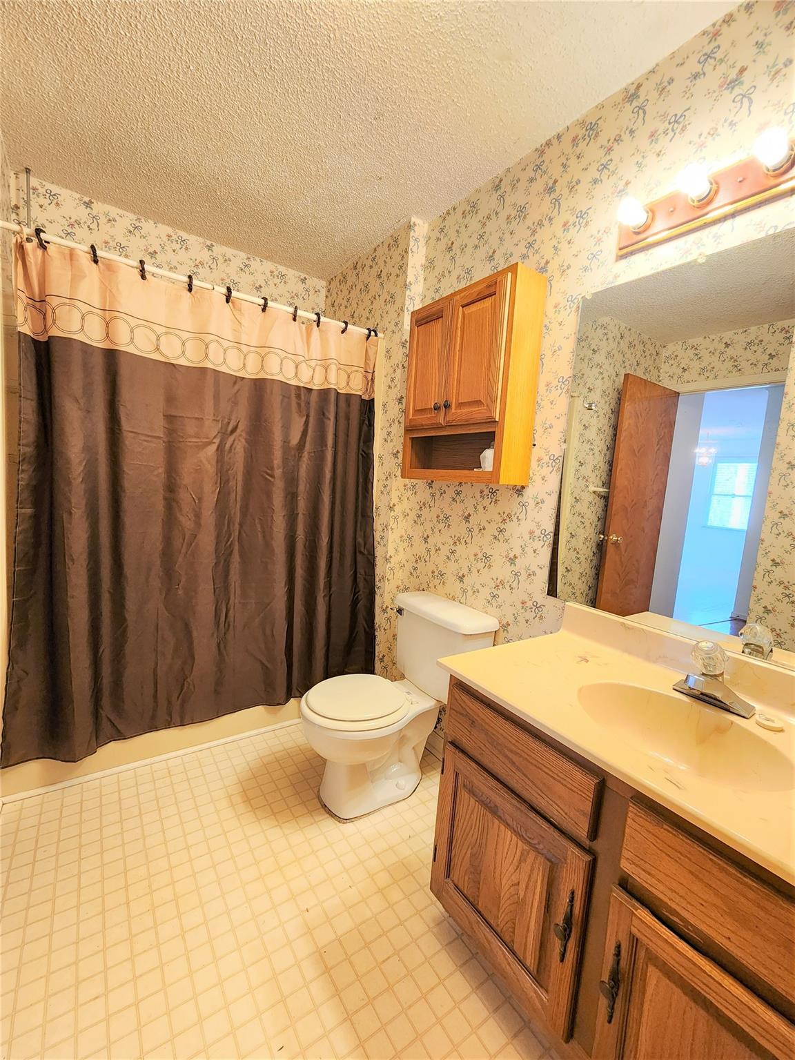 5542 Wagoner Road Gold Hill, NC 28071 - Photo 15 of 34 a bathroom with a sink a toilet and shower