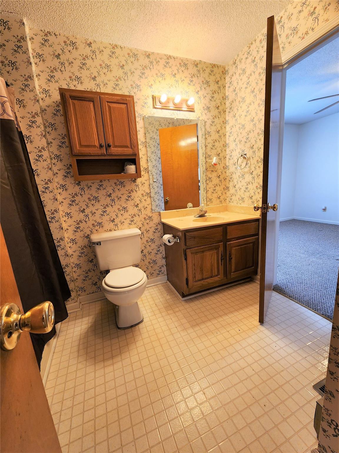 5542 Wagoner Road Gold Hill, NC 28071 - Photo 16 of 34 a bathroom with a toilet sink and mirror