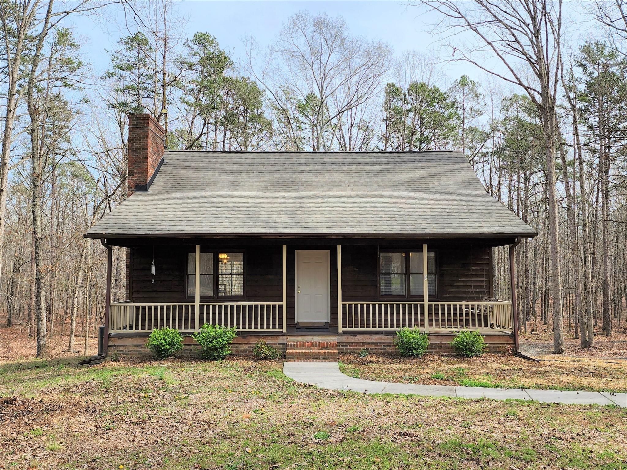 5542 Wagoner Road Gold Hill, NC 28071 - Photo 2 of 34 a front view of a house with a garden