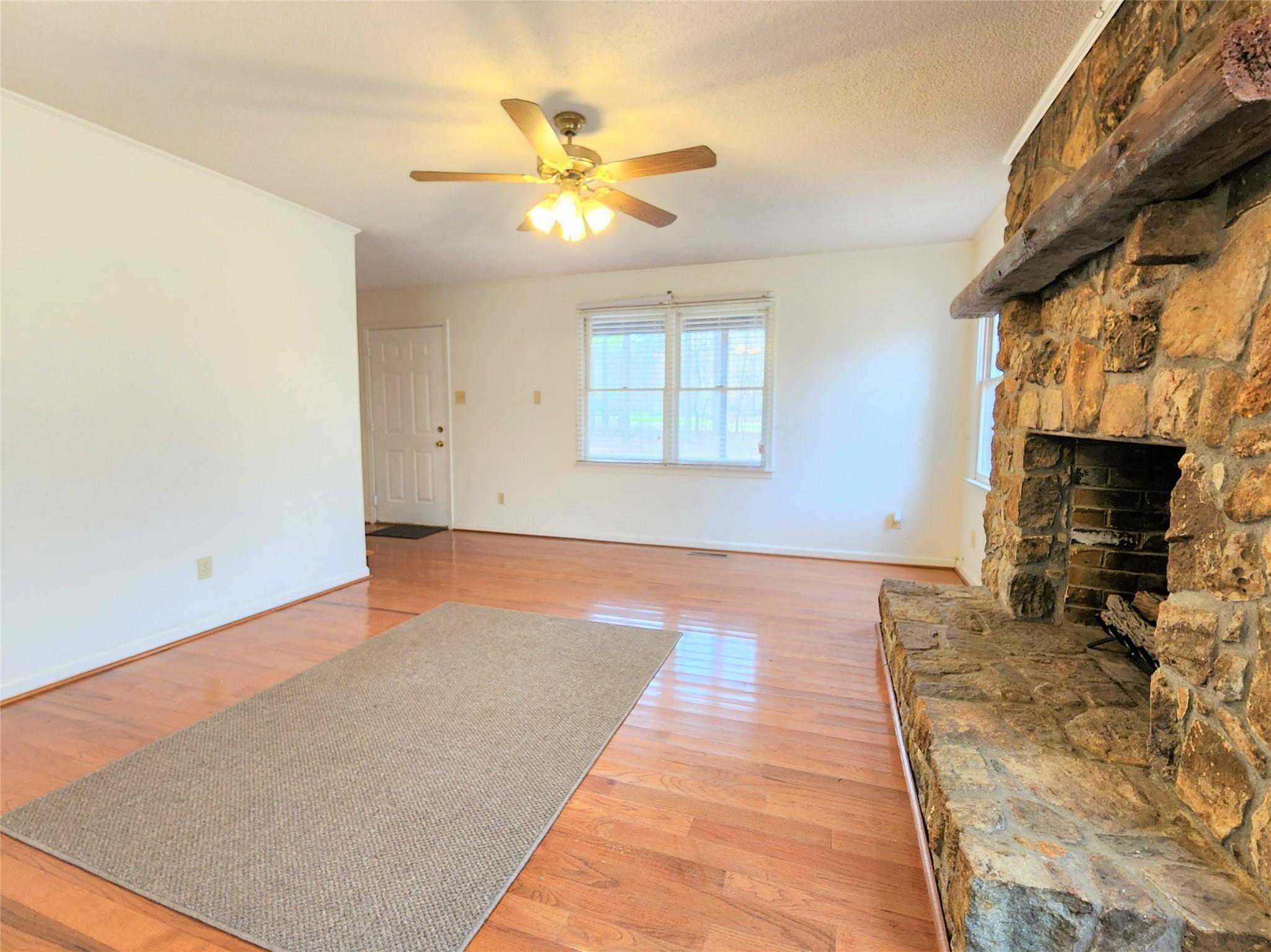 5542 Wagoner Road Gold Hill, NC 28071 - Photo 6 of 34 a bedroom with a bed and a fireplace