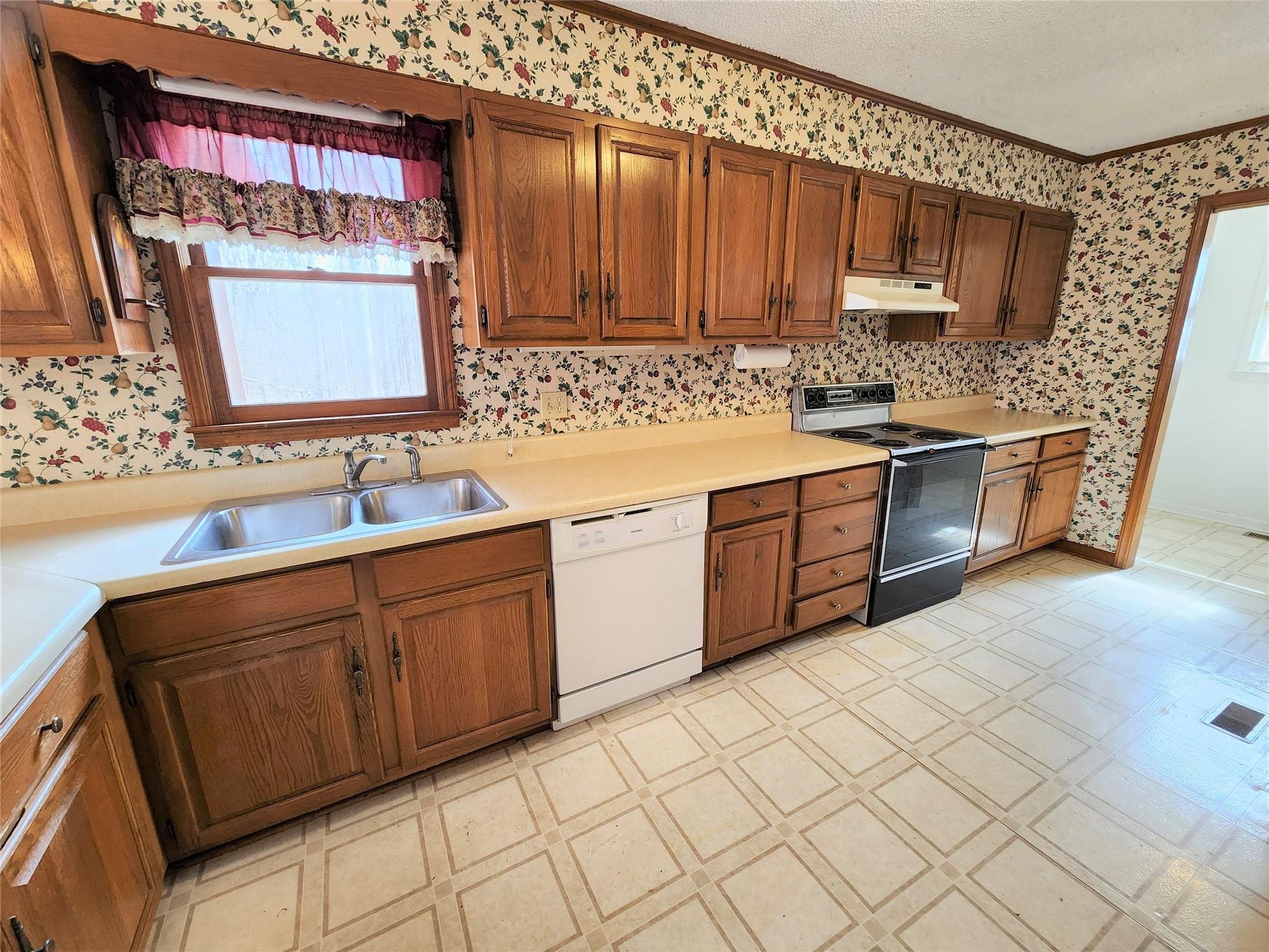 5542 Wagoner Road Gold Hill, NC 28071 - Photo 8 of 34 a kitchen with stainless steel appliances granite countertop a sink and cabinets
