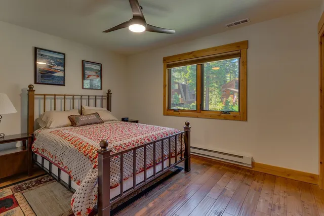 a bedroom with a bed and a lamp