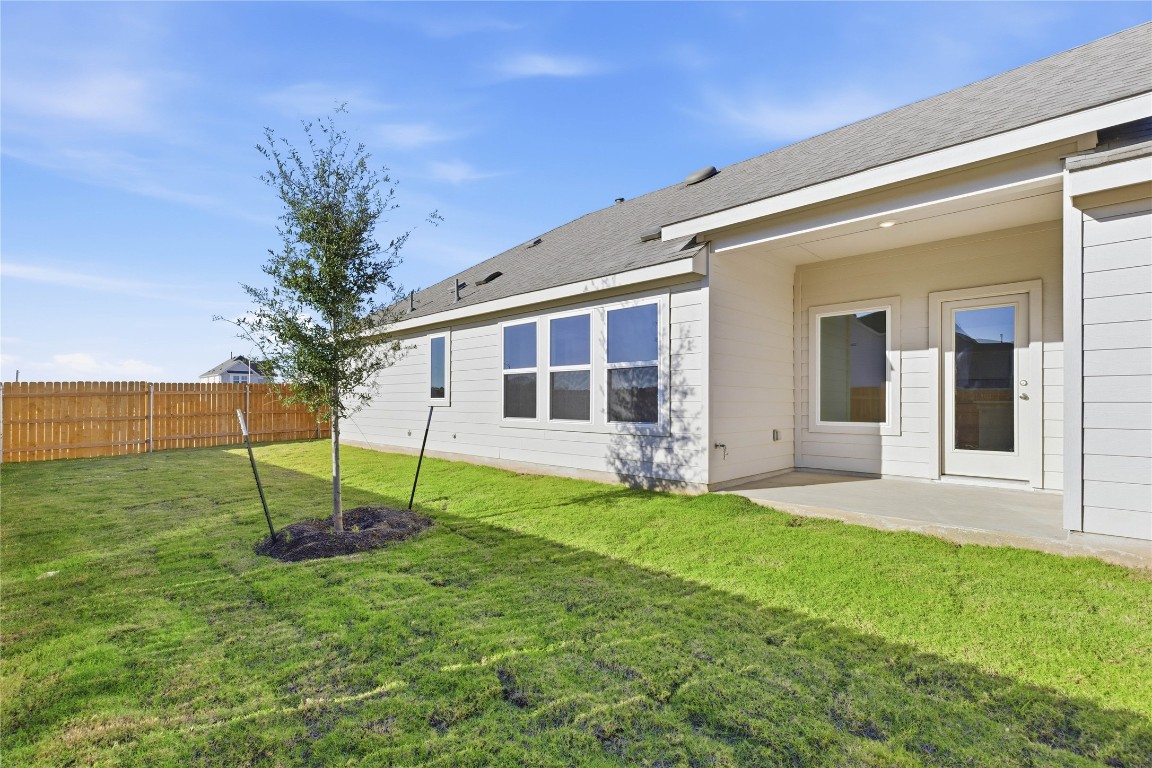 13500 Barn Chime Street Elgin, TX 78621 - Photo 11 of 14 a house view with a garden space
