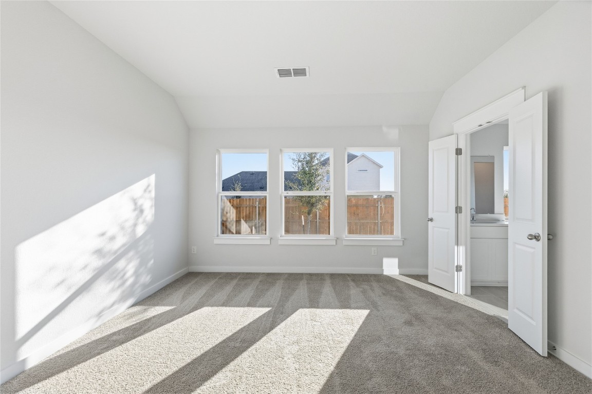 13500 Barn Chime Street Elgin, TX 78621 - Photo 5 of 14 a view of an empty room with a window