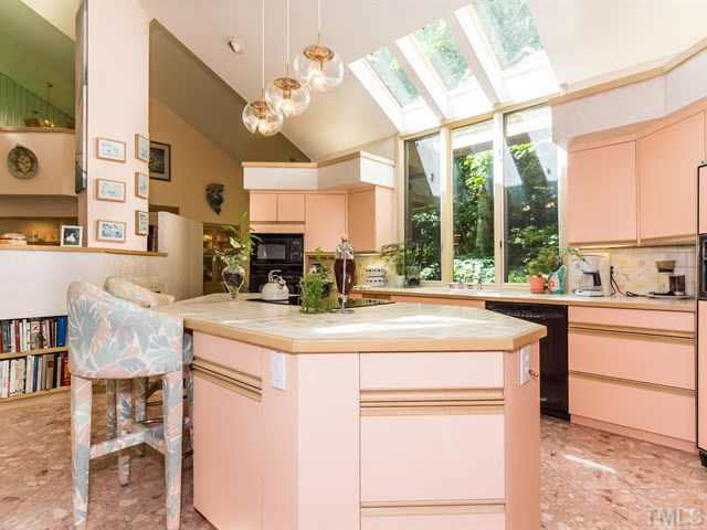 10000 Old Warden Road Raleigh, NC 27615 - Photo 15 of 25 Large center island with built-ins allows for seating. Kitchen