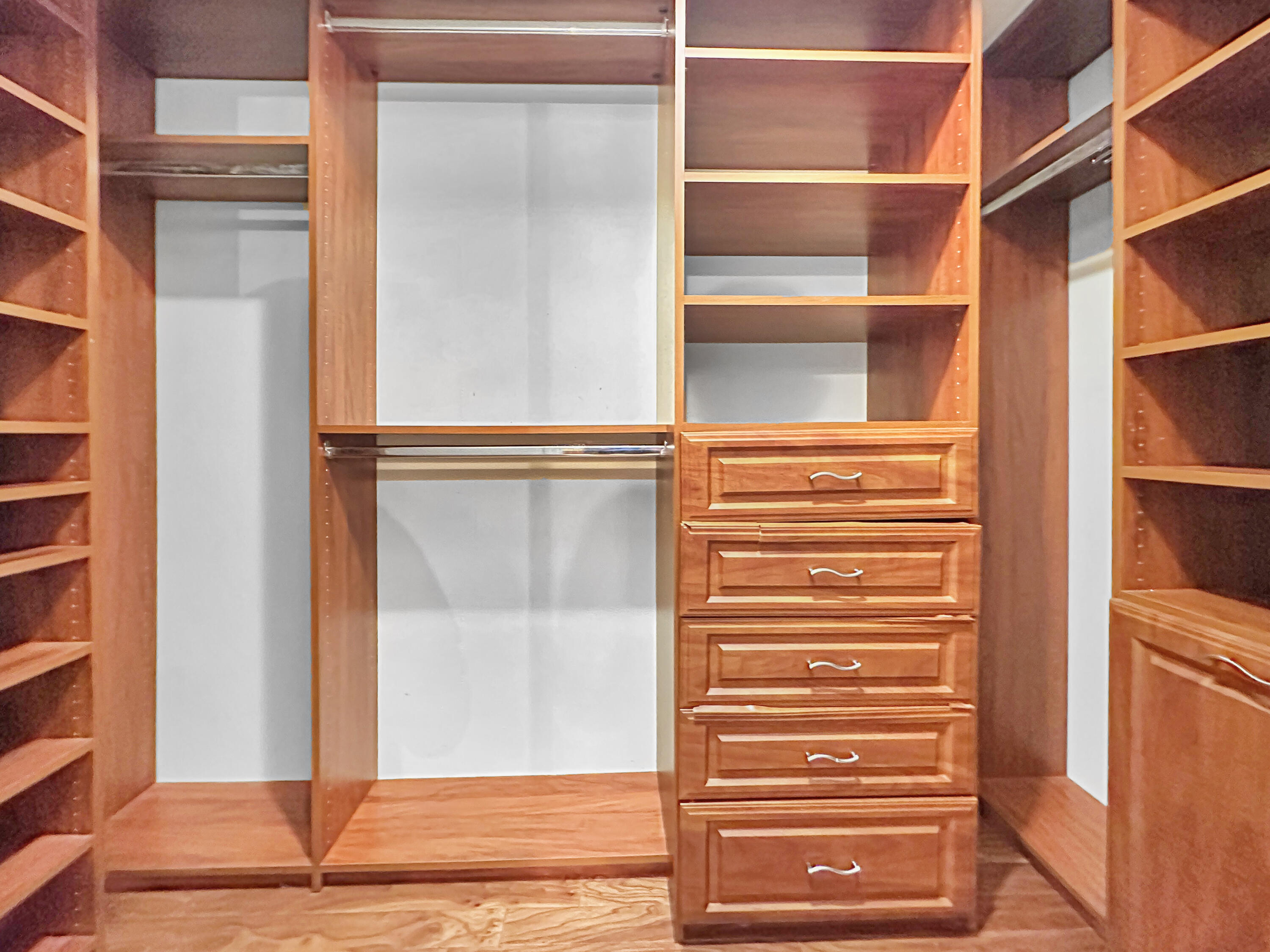 2761 Village Boulevard, Unit 306 West Palm Beach, FL 33409 - Photo 12 of 15 a view of walk in closet with empty racks