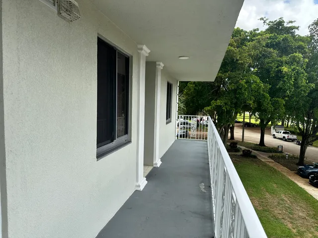 a view of a backyard with swimming pool