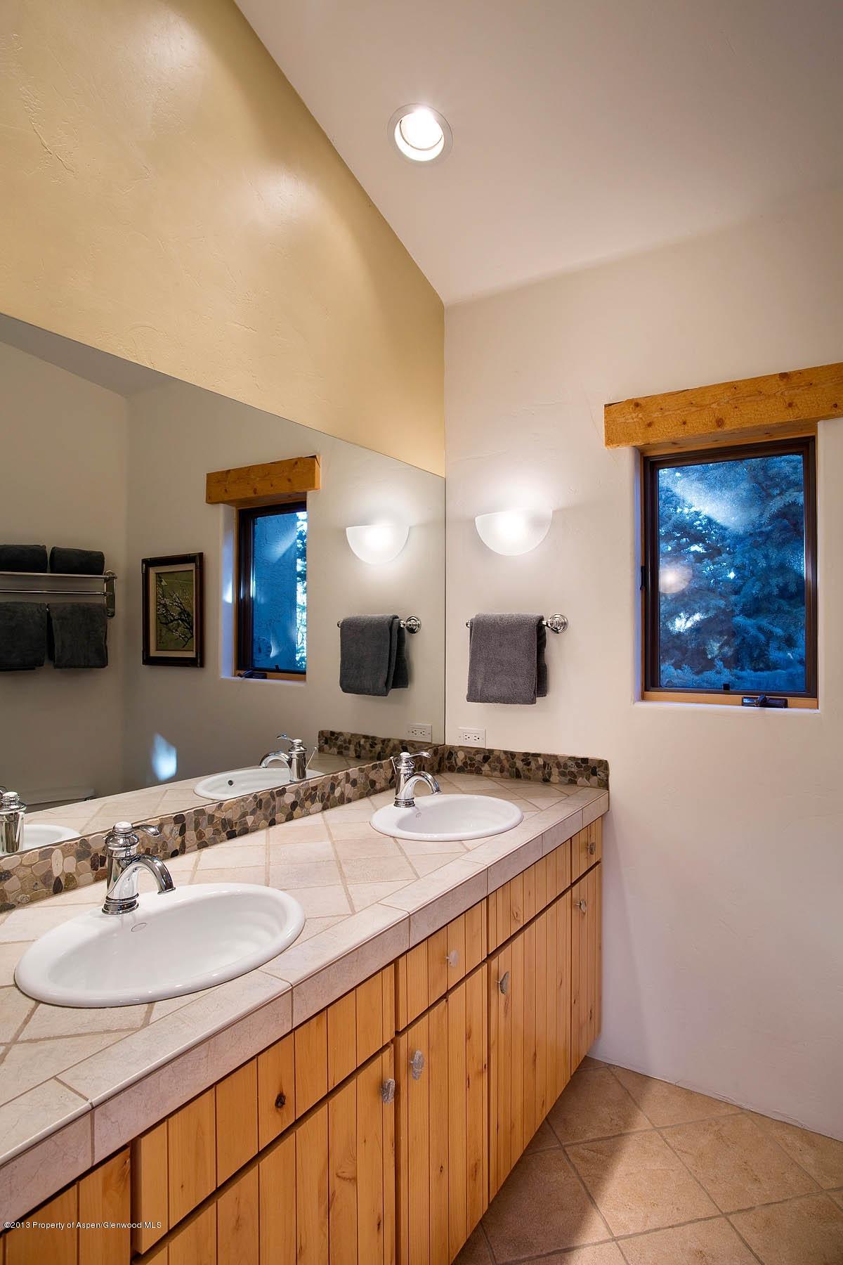 260 Riverside Drive Basalt, CO 81621 - Photo 12 of 24 a bathroom with a double vanity sink and a mirror