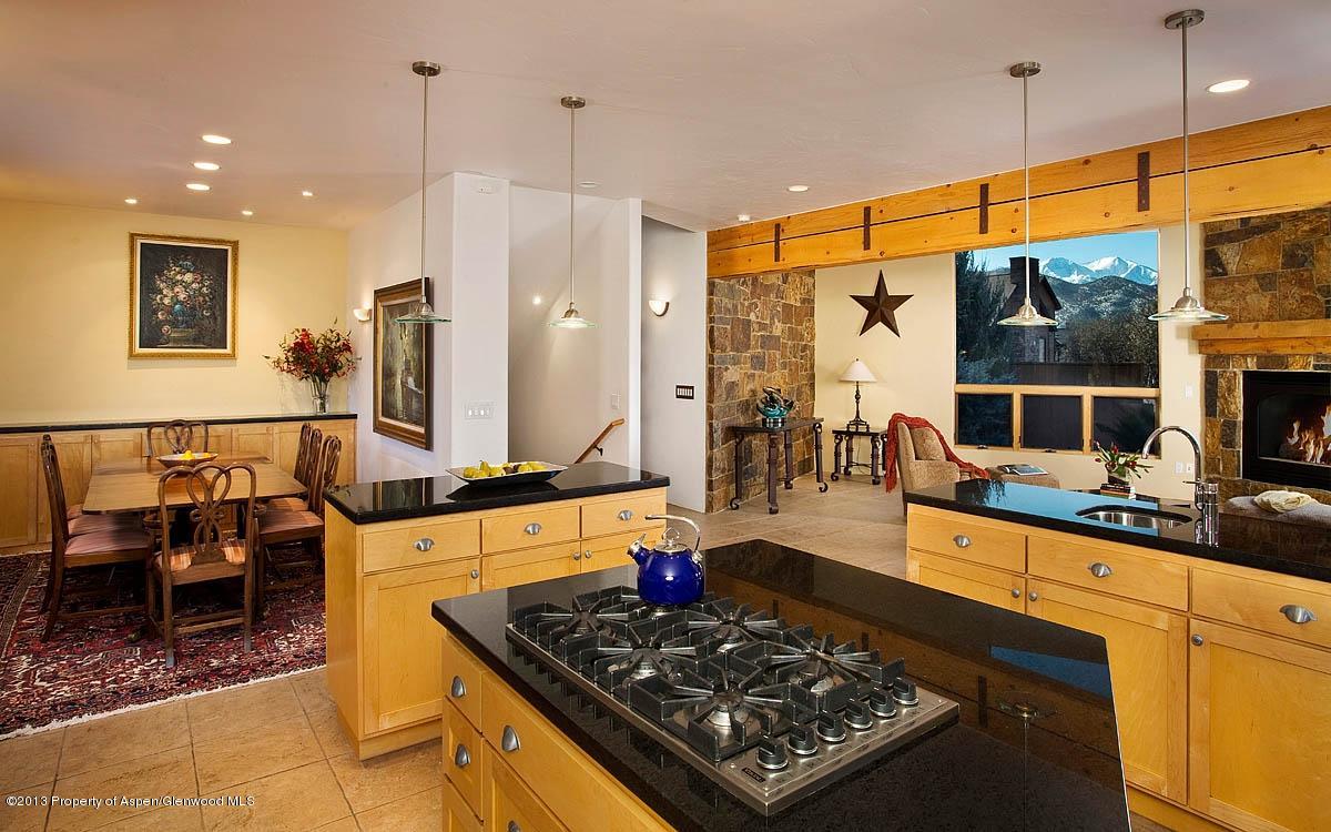 260 Riverside Drive Basalt, CO 81621 - Photo 9 of 24 a large kitchen with a table and chairs
