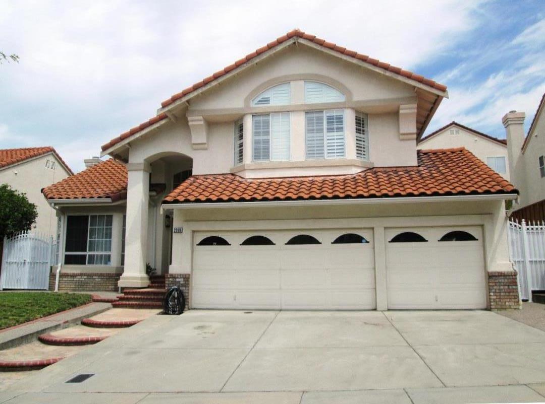 a front view of a house with yard