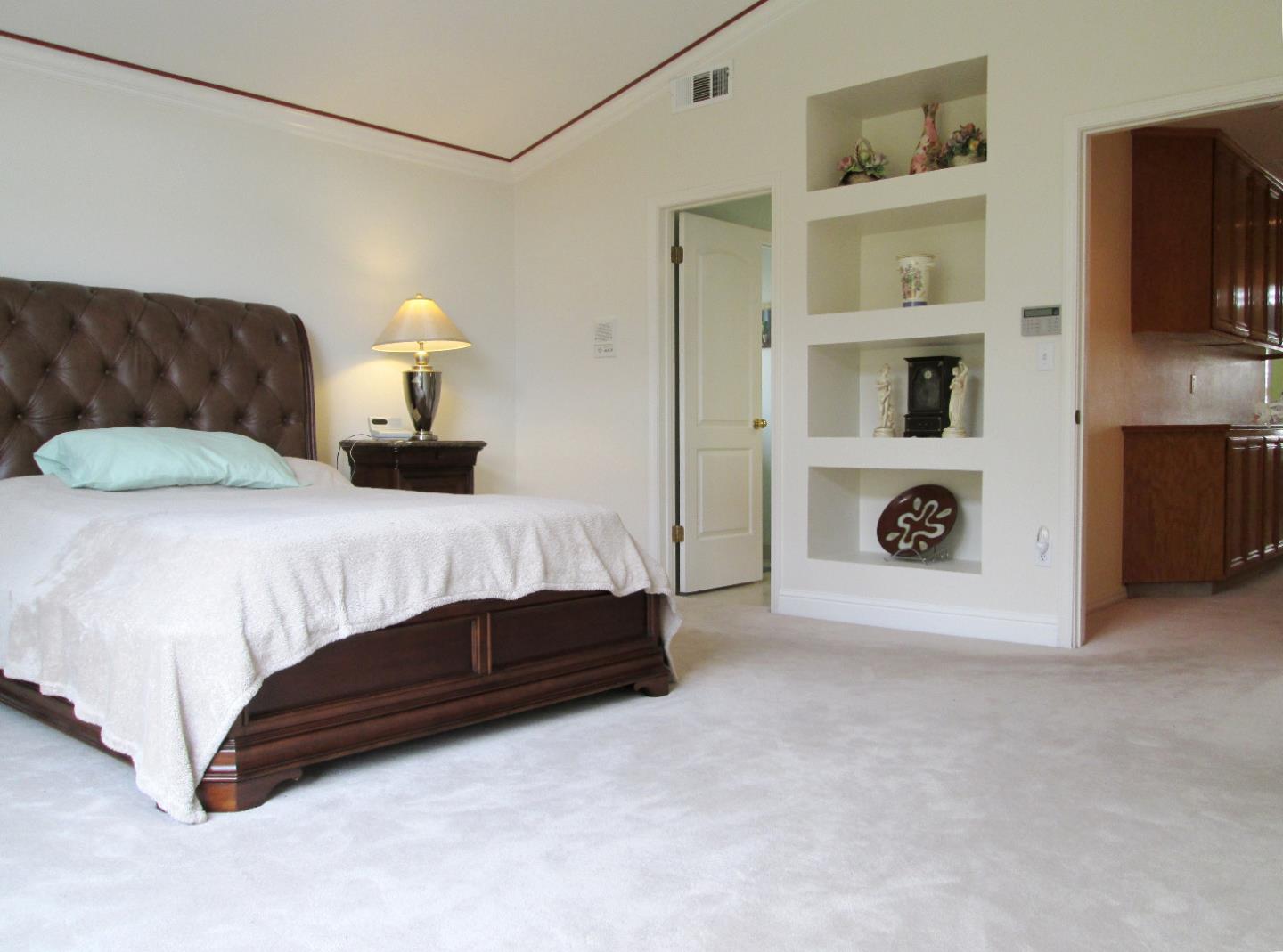 2319 Skyline Drive Milpitas, CA 95035 - Photo 13 of 20 a bedroom with a bed and a lamp on the dresser