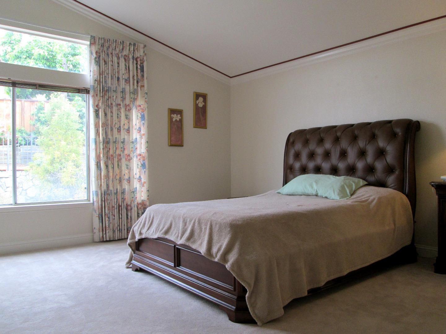 2319 Skyline Drive Milpitas, CA 95035 - Photo 14 of 20 a bed sitting in a bedroom next to a window