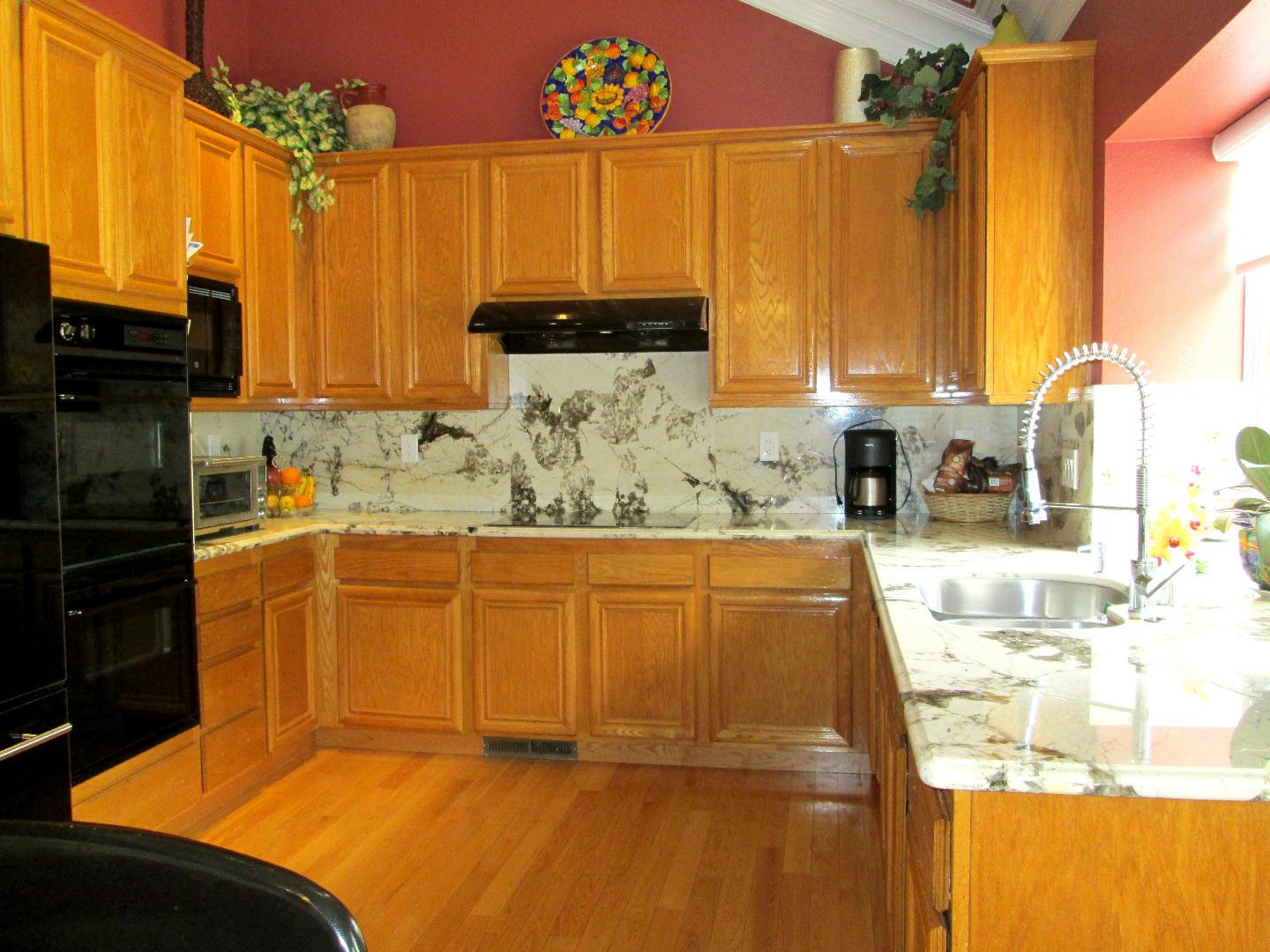 2319 Skyline Drive Milpitas, CA 95035 - Photo 3 of 20 a kitchen with stainless steel appliances a sink window and cabinets