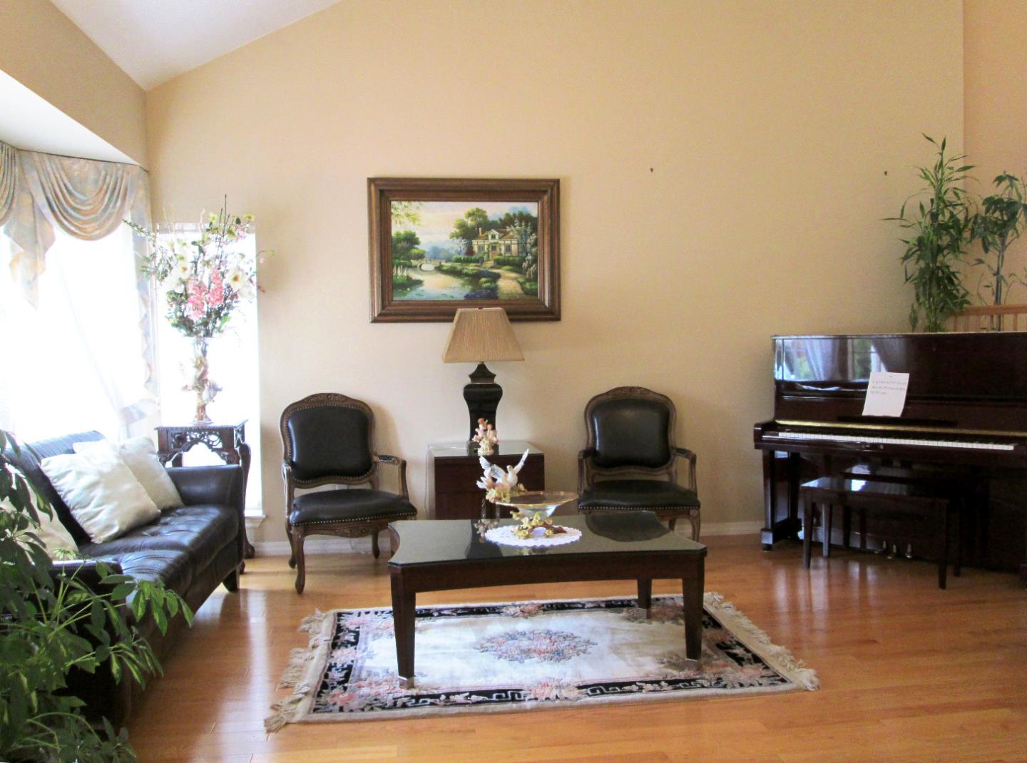 2319 Skyline Drive Milpitas, CA 95035 - Photo 10 of 20 a living room with furniture and a piano