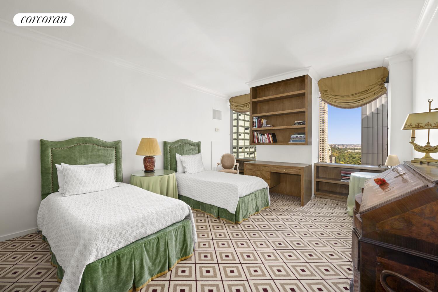 641 5th Avenue, Unit 28A Manhattan, NY 10022 - Photo 15 of 16 a bedroom with two beds and a window