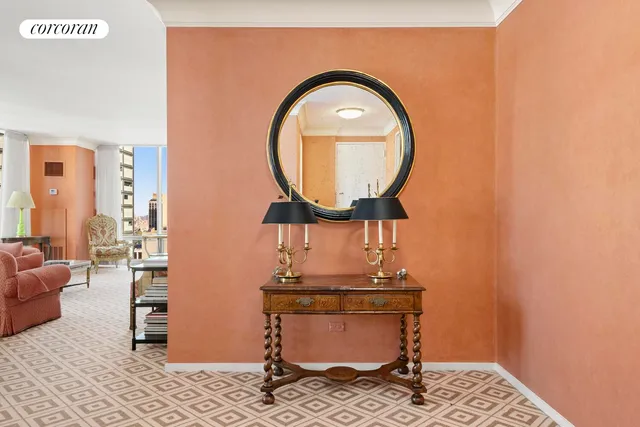 a room with furniture and a mirror