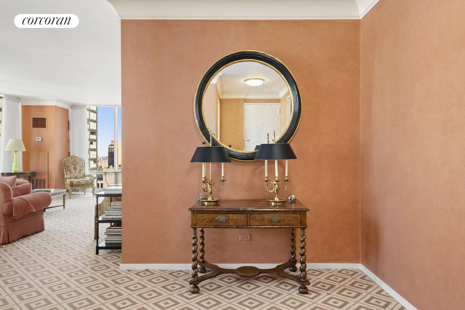 641 5th Avenue, Unit 28A Manhattan, NY 10022 - Photo 9 of 16 a room with furniture and a mirror