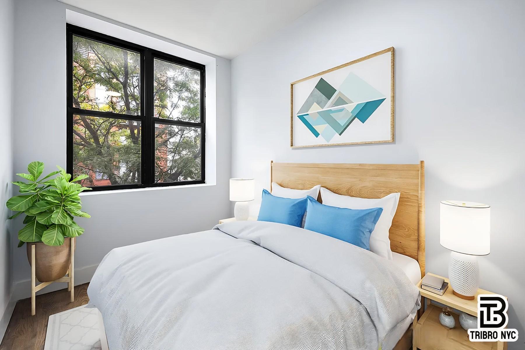 64 Stagg Street, Unit 3R Brooklyn, NY 11206 - Photo 5 of 7 a bedroom with a bed and a painting on the wall