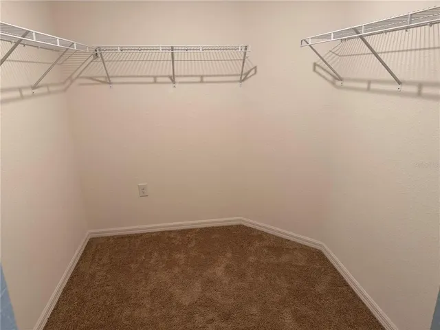 a view of a room with racks on the wall