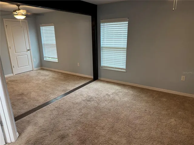 an empty room with windows