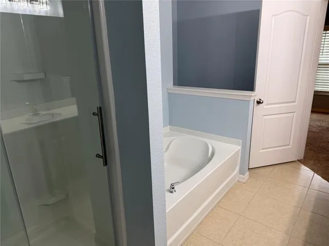 a white bath tub sitting in a bathroom
