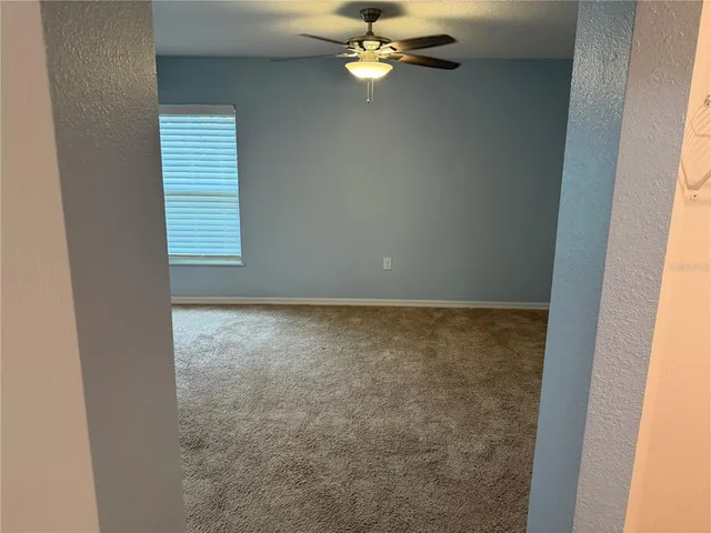 a view of a room with a fan