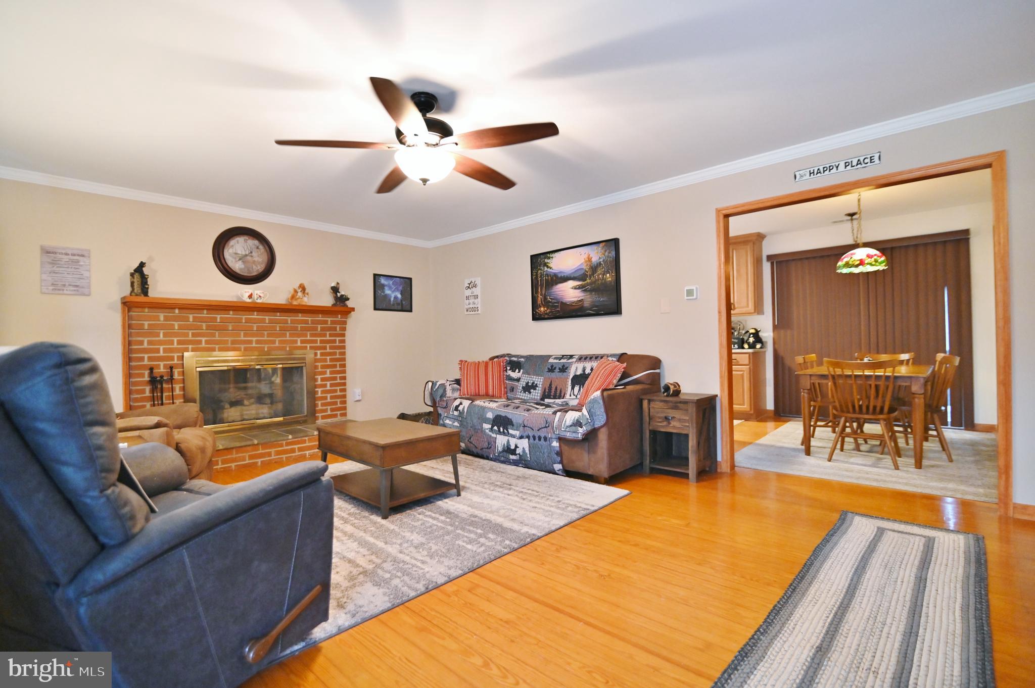 67 Plum Tree Lane Fort Valley, VA 22652 - Photo 19 of 47 a living room with furniture and a fireplace