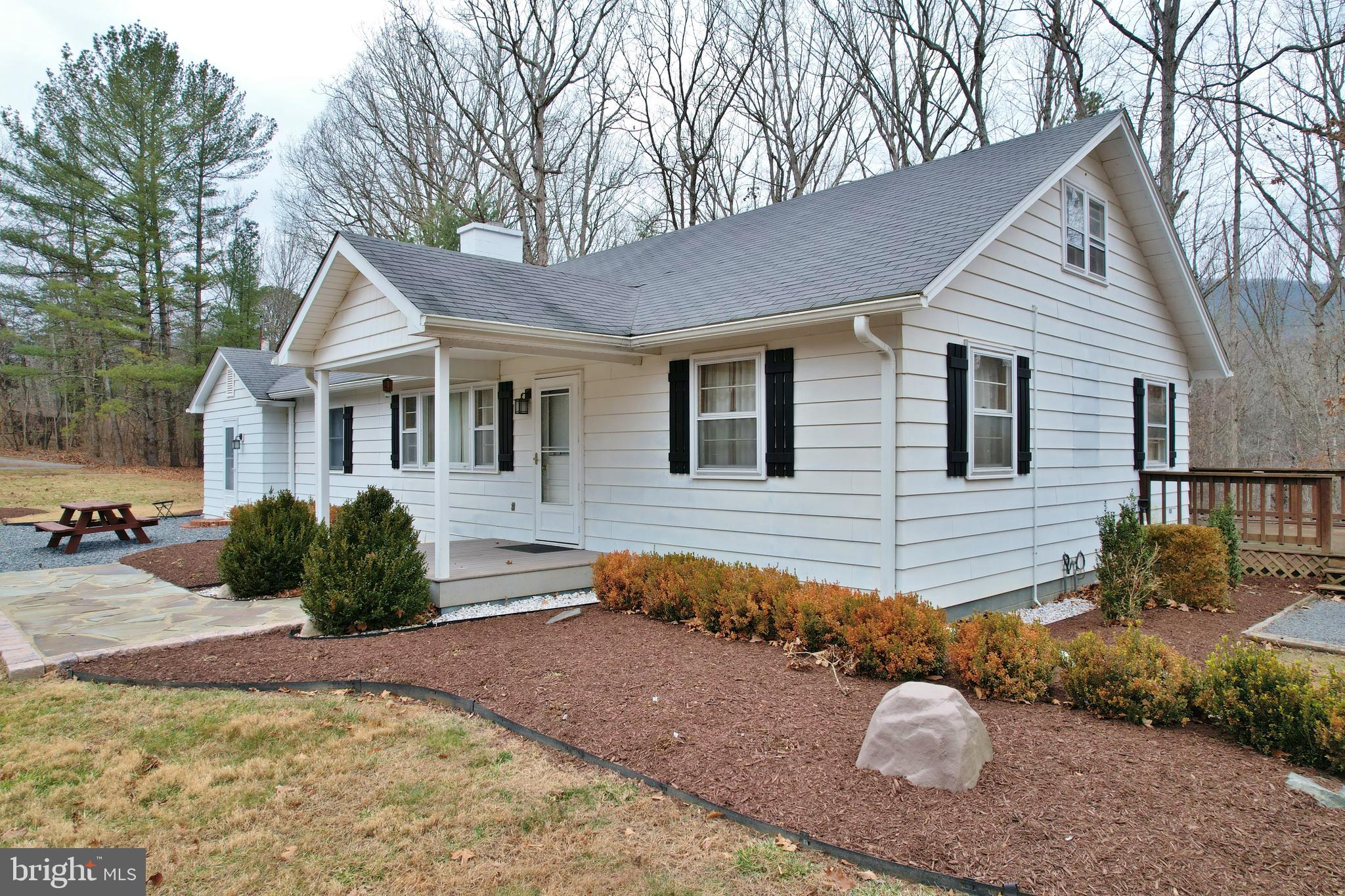 67 Plum Tree Lane Fort Valley, VA 22652 - Photo 2 of 47 a front view of a house with a yard