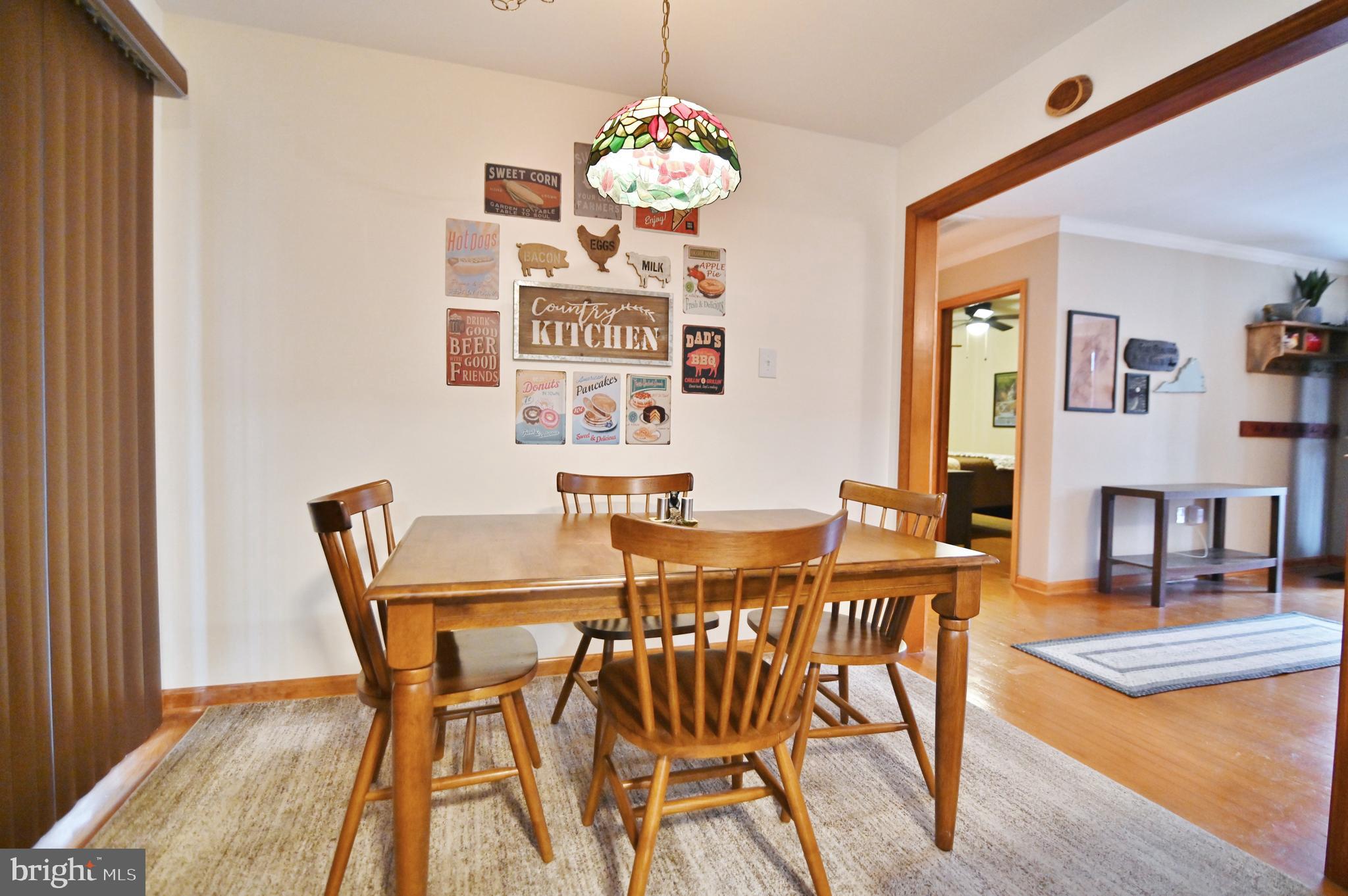 67 Plum Tree Lane Fort Valley, VA 22652 - Photo 26 of 47 a view of a dining room with furniture and chandelier