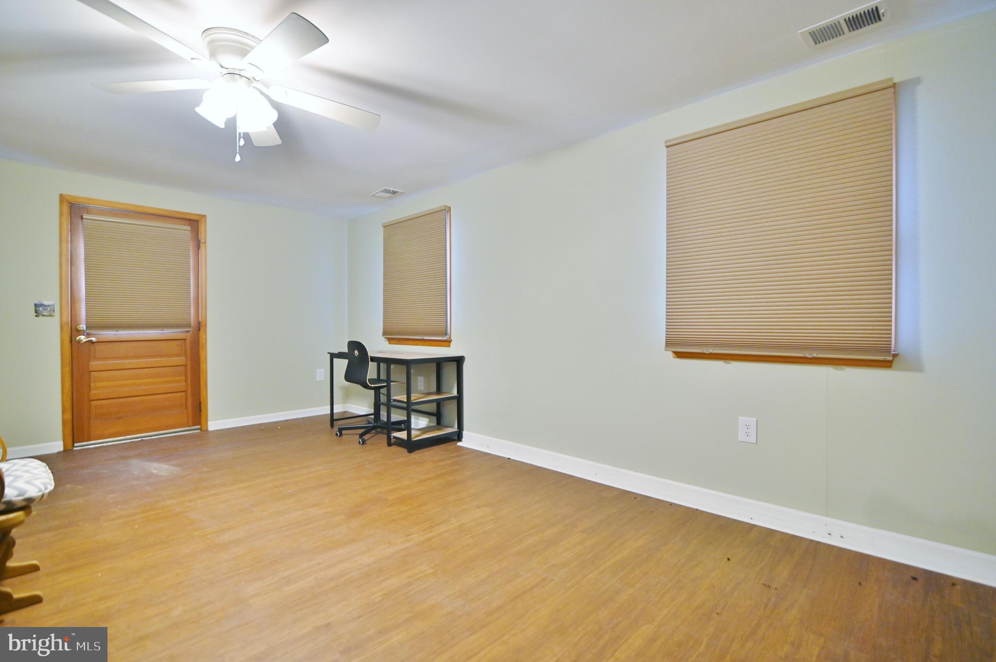 67 Plum Tree Lane Fort Valley, VA 22652 - Photo 41 of 47 a view of a room with a window and a ceiling fan