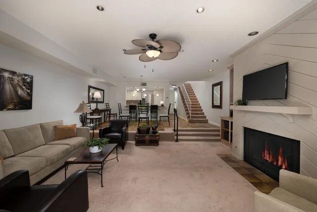 a living room with furniture and a fireplace