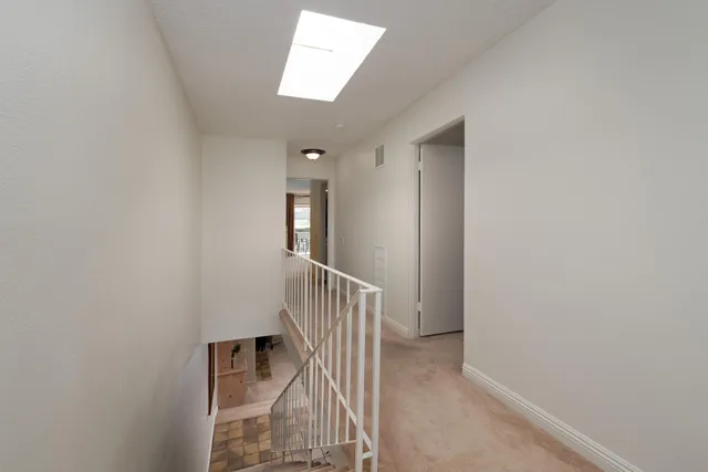 a view of hallway with stairs