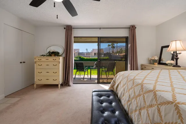 a bed room with a bed and a television