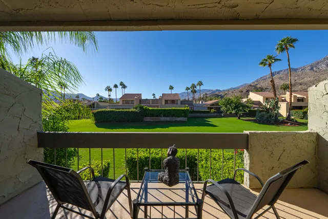 a view of a chairs and table in patio