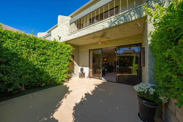 a view of a building with potted plants
