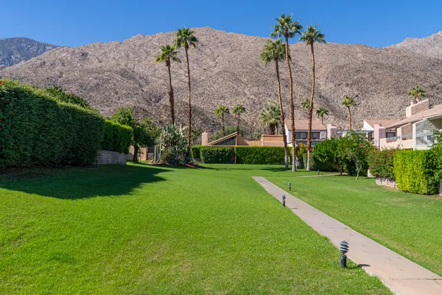 a view of a building with a yard