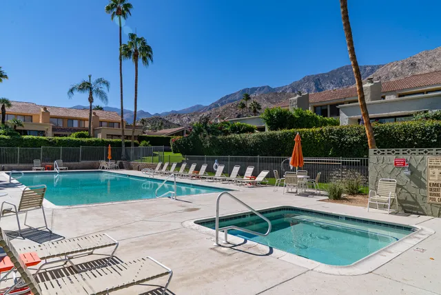 a view of a chairs and table in patio