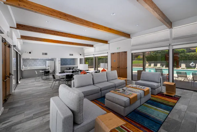 a living room with furniture and a table