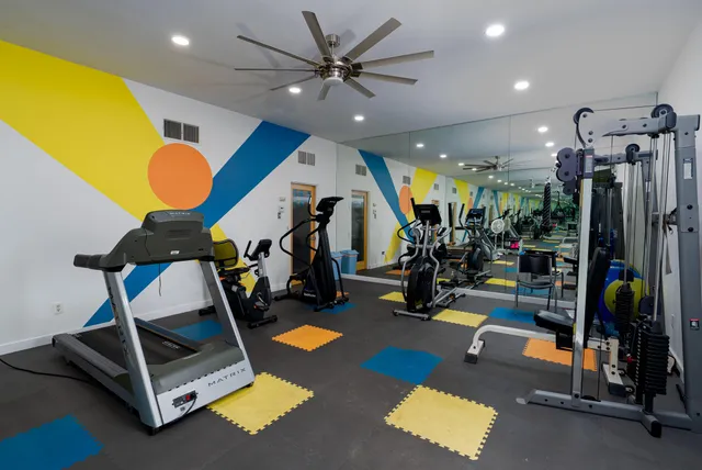 a room with gym equipment and a gym equipment