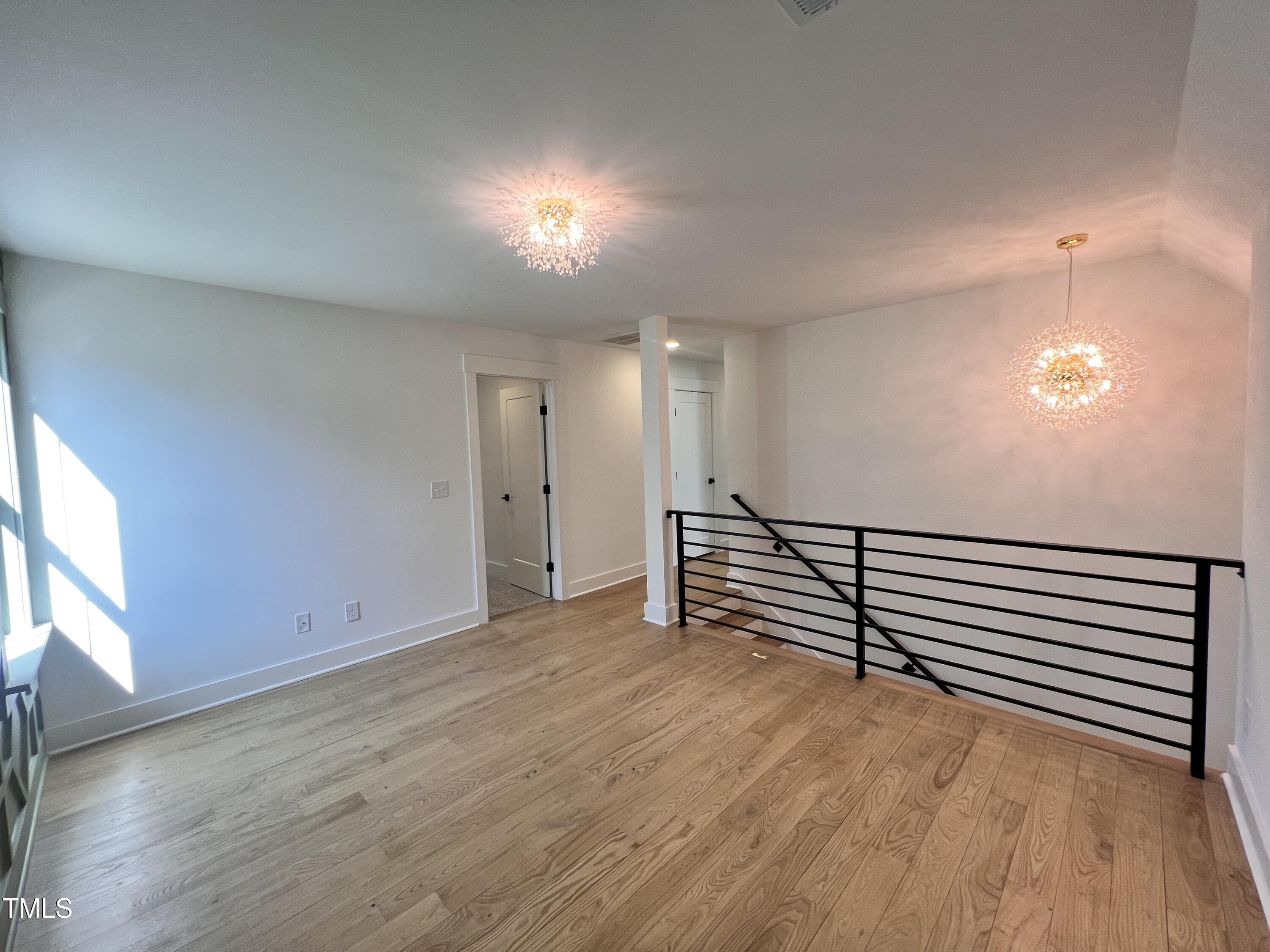 727 Cook Road Durham, NC 27713 - Photo 33 of 50 a view of a room with wooden floor