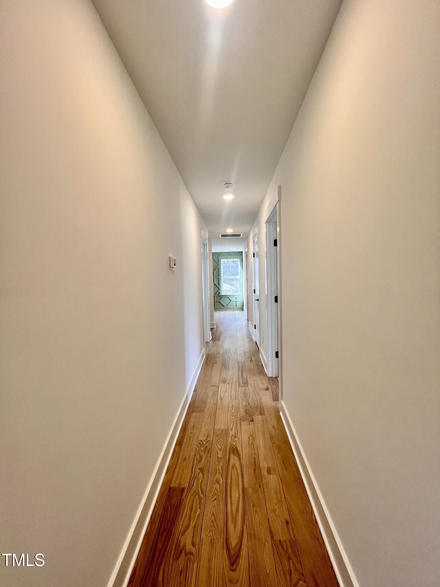727 Cook Road Durham, NC 27713 - Photo 37 of 50 a view of a hallway with wooden floor