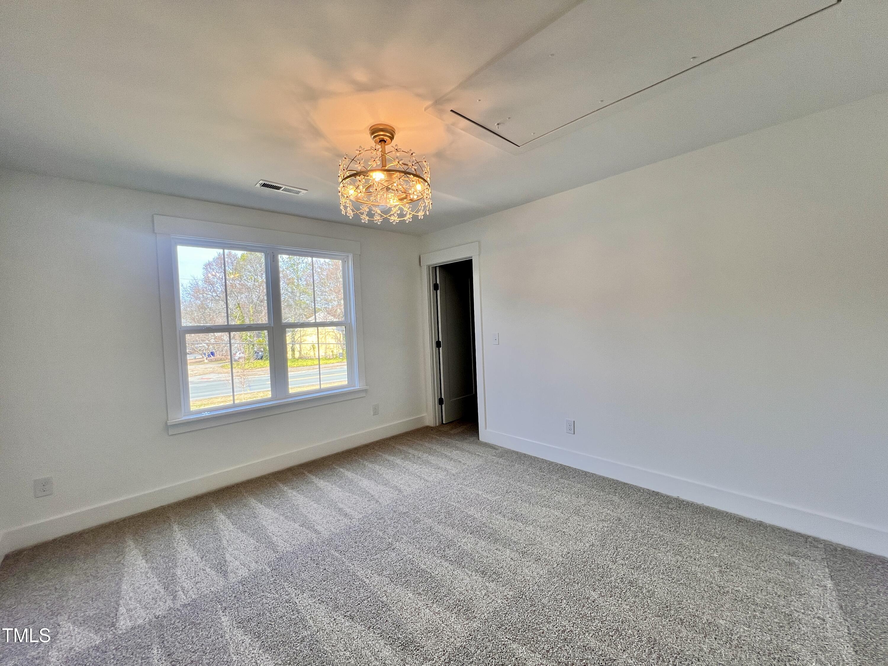 727 Cook Road Durham, NC 27713 - Photo 41 of 50 an empty room with a window