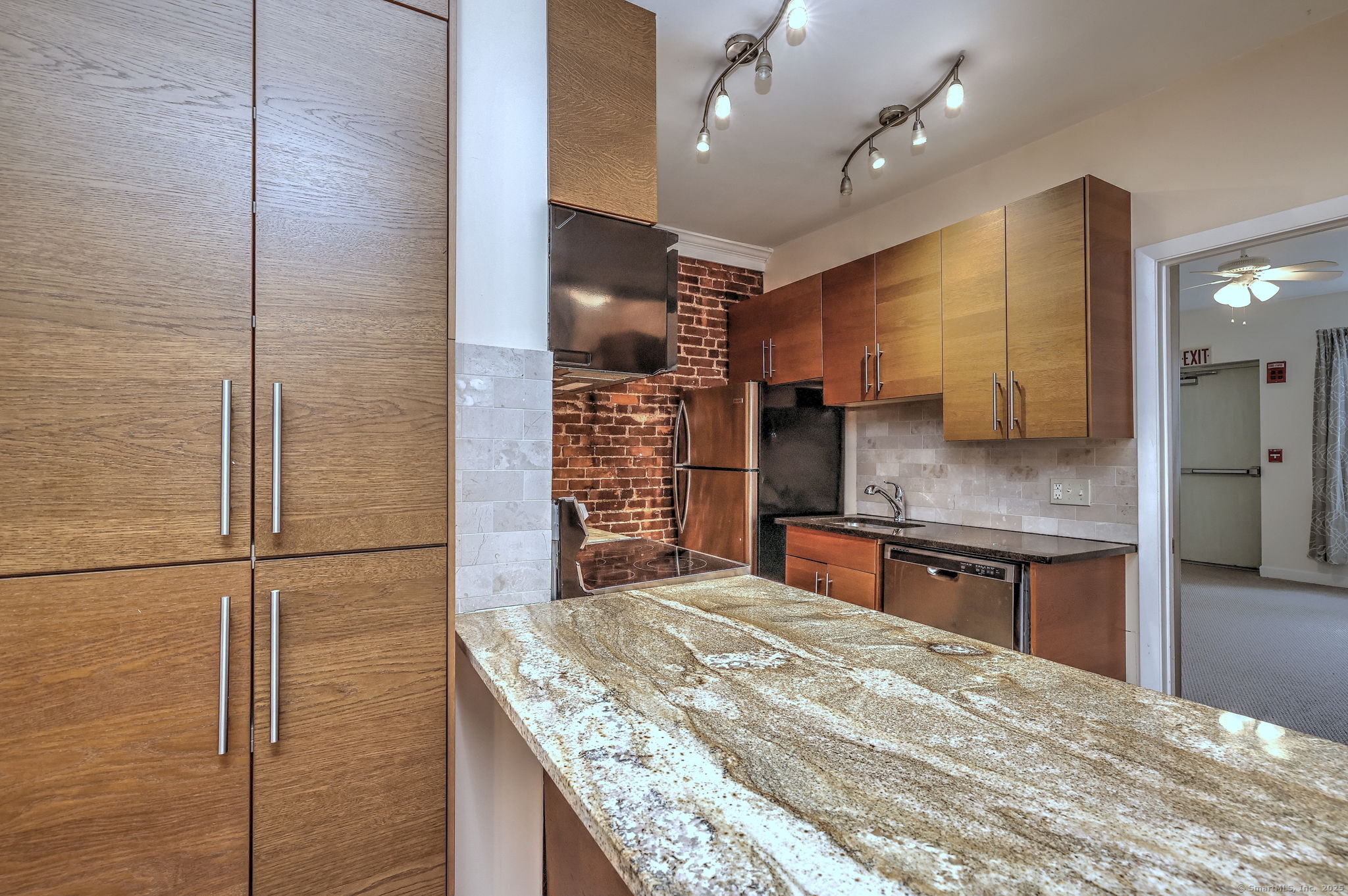 844 Grand Avenue, Unit 2 New Haven, CT 06511 - Photo 14 of 36 a kitchen with kitchen island a counter top space stainless steel appliances and cabinets