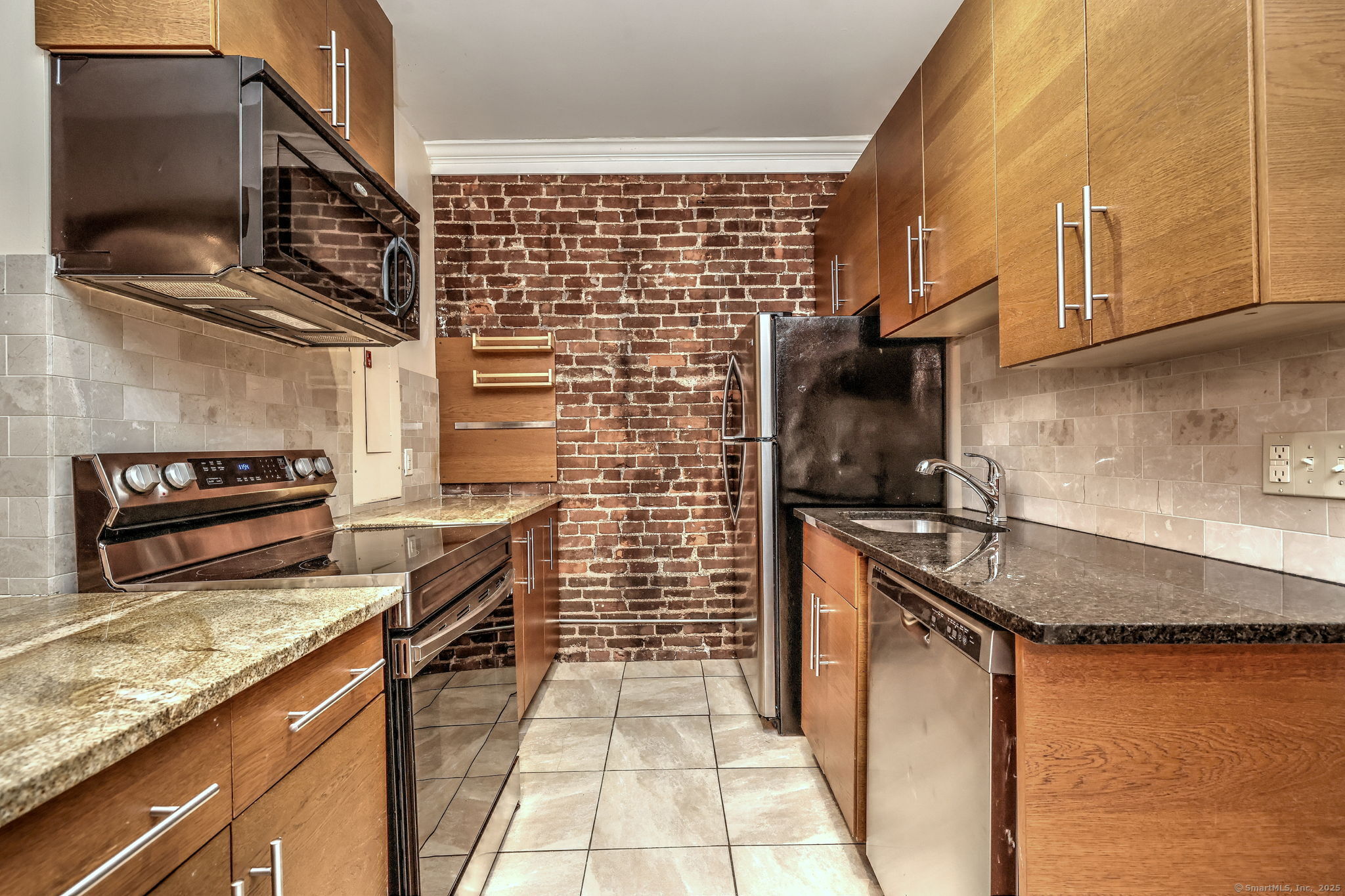 844 Grand Avenue, Unit 2 New Haven, CT 06511 - Photo 15 of 36 a kitchen with stainless steel appliances granite countertop a sink stove and refrigerator