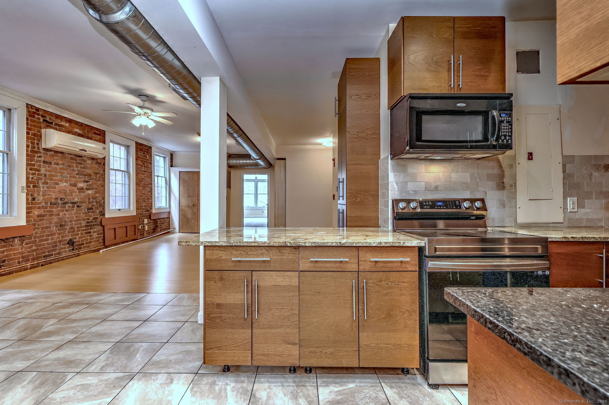 844 Grand Avenue, Unit 2 New Haven, CT 06511 - Photo 20 of 36 a kitchen with kitchen island granite countertop a stove and a sink
