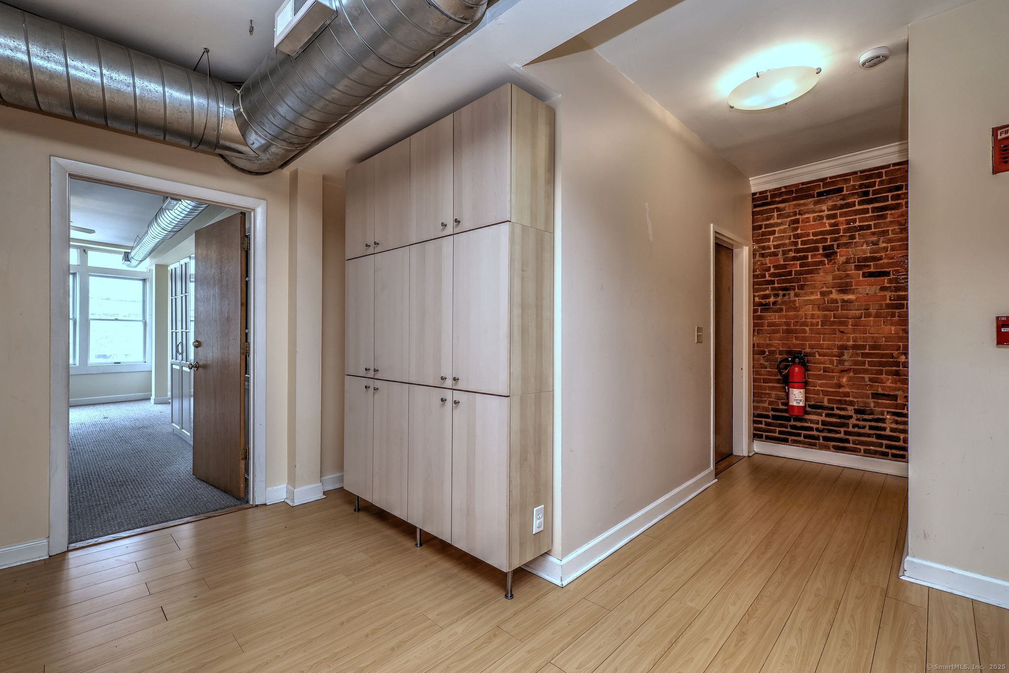 844 Grand Avenue, Unit 2 New Haven, CT 06511 - Photo 21 of 36 a view of an empty room with wooden floor