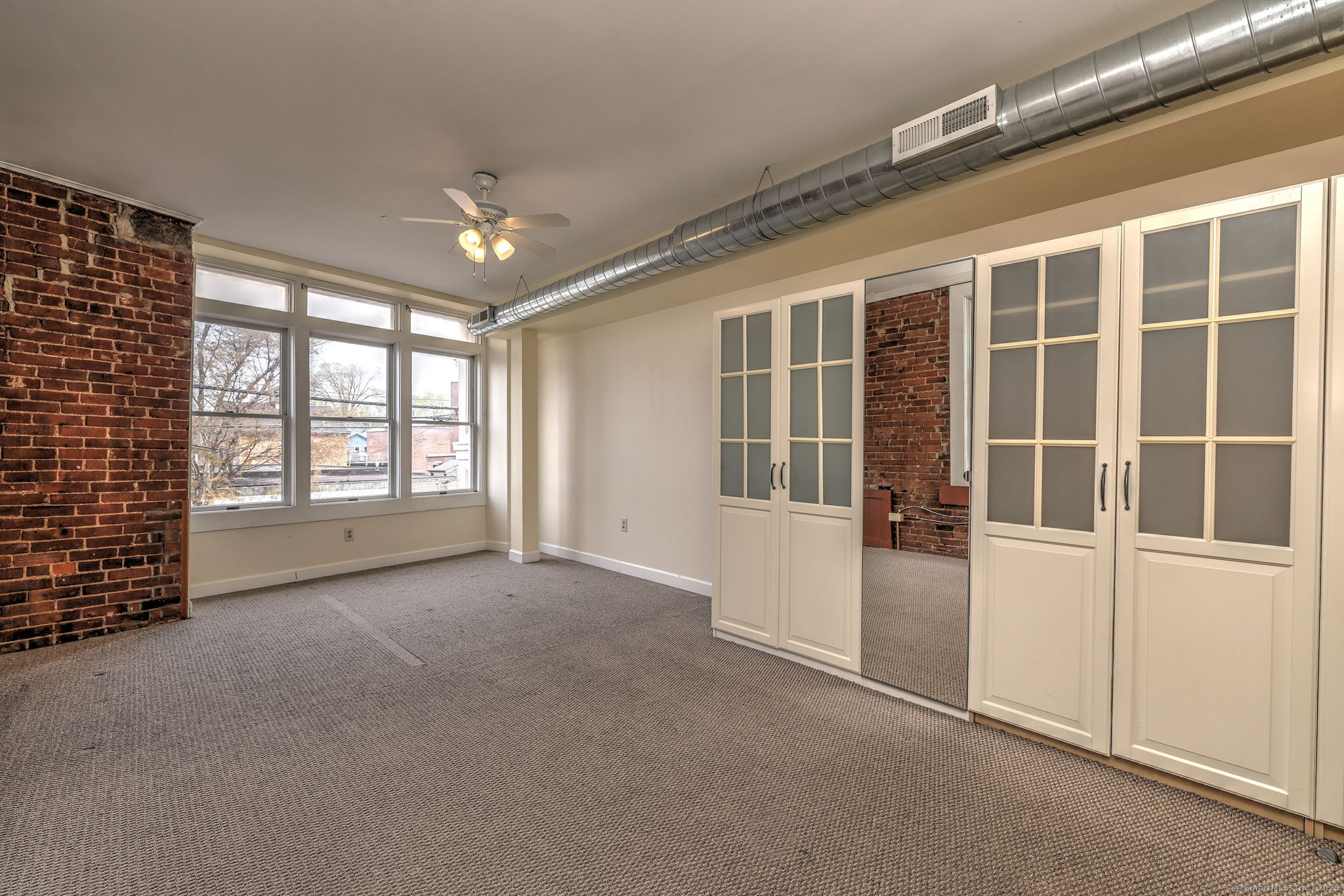 844 Grand Avenue, Unit 2 New Haven, CT 06511 - Photo 23 of 36 a view of an empty room with a window
