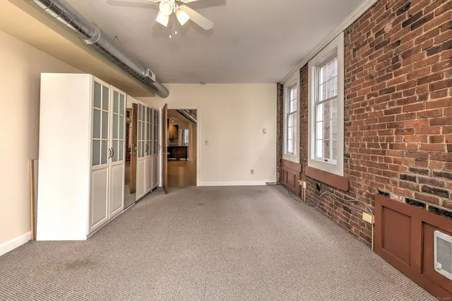a bathroom with a bathtub sink vanity and mirror
