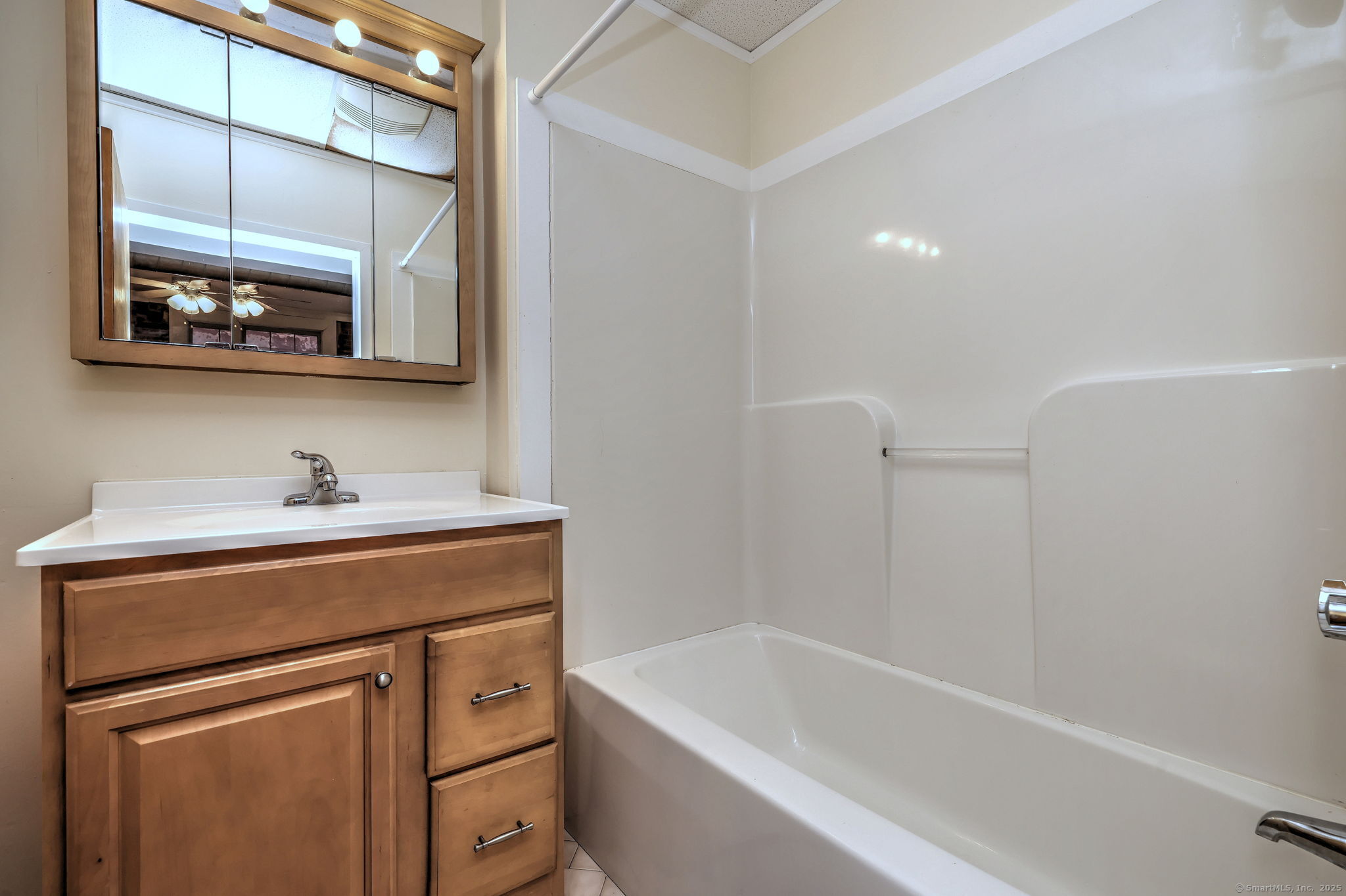 844 Grand Avenue, Unit 2 New Haven, CT 06511 - Photo 26 of 36 a bathroom with a bathtub sink vanity and mirror